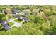 Aerial view of the property showcasing lush landscaping and neighborhood with mature trees at 3837 1St Street Nw Ln, Hickory, NC 28601
