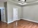 Spacious bedroom features hardwood floors, tray ceiling, and neutral color palette at 3837 1St Street Nw Ln, Hickory, NC 28601