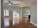 Bright living room with hardwood floors, trey ceiling, a ceiling fan and access to the outdoor deck at 3837 1St Street Nw Ln, Hickory, NC 28601