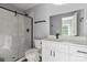 Beautifully renovated bathroom with a glass shower, white cabinets, and modern fixtures at 405 E Broad St, Salisbury, NC 28144