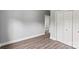 Bedroom with light gray walls, modern floors, and a closet in the room at 405 E Broad St, Salisbury, NC 28144