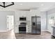 Updated kitchen featuring stainless steel appliances and white cabinetry with modern finishes at 405 E Broad St, Salisbury, NC 28144