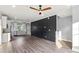 Stylish open-concept living room with wood floors, designer paint and modern fixtures at 405 E Broad St, Salisbury, NC 28144
