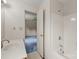 Neutral bathroom with a white sink and bathtub and access to an adjacent bedroom at 416 Park Ave, Granite Quarry, NC 28072