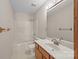 Full bathroom with a shower-tub combination and light wood vanity with a white sink at 416 Park Ave, Granite Quarry, NC 28072