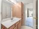 Bathroom with a vanity and a mirror with updated light fixtures at 416 Park Ave, Granite Quarry, NC 28072