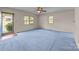 Inviting bedroom featuring blue carpeting, natural light, and neutral paint at 416 Park Ave, Granite Quarry, NC 28072