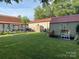 Spacious fenced backyard with lush green grass and multiple storage sheds at 4303 Grier St, Gastonia, NC 28056