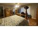 Bright bedroom featuring a wooden bed frame, ceiling fan, and windows at 4303 Grier St, Gastonia, NC 28056