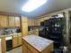Functional kitchen featuring light-colored cabinets and a central island with space for food prep at 4303 Grier St, Gastonia, NC 28056