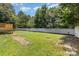 Spacious backyard with lush green grass and a white fence, perfect for outdoor enjoyment at 608 Red Hawk Way, Clover, SC 29710