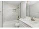 Bathroom with a modern bathtub, stylish fixtures, bright vanity, and elegant tile work at 608 Red Hawk Way, Clover, SC 29710