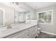 Bright bathroom featuring modern vanity with sleek hardware, stylish mirror, and a glass-enclosed shower at 608 Red Hawk Way, Clover, SC 29710