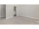 Bright bedroom with ensuite bathroom and neutral carpet, offering a serene living space at 608 Red Hawk Way, Clover, SC 29710