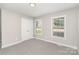 Carpeted bedroom with windows allowing natural light, creating a comfortable and inviting atmosphere at 608 Red Hawk Way, Clover, SC 29710