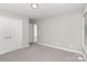 Carpeted bedroom with closet and a window allowing natural light, creating a comfortable atmosphere at 608 Red Hawk Way, Clover, SC 29710