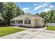 A well-maintained home featuring a cozy front porch, a driveway, and a small wooden deck on the side at 608 Red Hawk Way, Clover, SC 29710