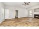 Spacious living room featuring a fireplace, hardwood floors, and natural light, ideal for Gathering gatherings at 608 Red Hawk Way, Clover, SC 29710