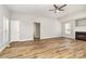Spacious living room featuring a fireplace, hardwood floors, and natural light, ideal for Gathering gatherings at 608 Red Hawk Way, Clover, SC 29710