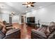 Spacious living room features hardwood floors, modern ceiling fans and neutral wall paint at 7648 Forest Oak Dr, Denver, NC 28037