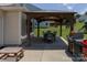 The home's backyard features a covered patio gazebo with dining furniture, grilling area, and great outdoor potential at 864 Pointe Andrews Dr, Concord, NC 28025