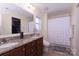 Bathroom featuring double vanity with granite countertop and decorative shower curtain at 864 Pointe Andrews Dr, Concord, NC 28025