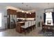 Modern kitchen featuring granite countertops, stainless appliances, and a central island with barstool seating at 864 Pointe Andrews Dr, Concord, NC 28025