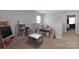 Spacious playroom with furniture and toys including a chalkboard and toy kitchen at 864 Pointe Andrews Dr, Concord, NC 28025