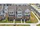 An aerial view of townhomes displaying meticulous landscaping, coordinated exteriors, and community layout at 9921 Oaklawn Nw Blvd, Huntersville, NC 28078