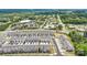 Wide aerial shot showing new development townhomes with a blend of residential and commercial areas at 9921 Oaklawn Nw Blvd, Huntersville, NC 28078