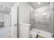 A sleek bathroom with a tiled shower, glass enclosure, and modern fixtures at 9921 Oaklawn Nw Blvd, Huntersville, NC 28078