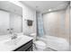 Well-lit bathroom showcasing a shower over bath with tile surround, sleek vanity, and modern fixtures at 9921 Oaklawn Nw Blvd, Huntersville, NC 28078