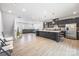 A spacious open-concept kitchen with an island and stainless steel appliances overlooks the living area at 9921 Oaklawn Nw Blvd, Huntersville, NC 28078