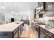 Bright kitchen featuring an island, modern appliances, and hardwood floors at 9921 Oaklawn Nw Blvd, Huntersville, NC 28078