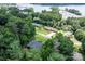 Aerial view of the home and neighborhood amenities like a pool and lake access, surrounded by lush greenery and trees at 109 Joe Teague Rd, Hickory, NC 28601