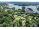 Aerial view of property near public boat ramp, picnic area, beach, and marina on the lake at 109 Joe Teague Rd, Hickory, NC 28601