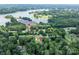 Aerial view showing the property, public lake access, and surrounding neighborhood with lush green landscape at 109 Joe Teague Rd, Hickory, NC 28601