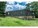 Exterior view of the home showcases a well-maintained lawn and a spacious backyard at 109 Joe Teague Rd, Hickory, NC 28601