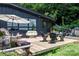 Inviting backyard patio with outdoor seating, a grill, and access to a screened-in porch at 109 Joe Teague Rd, Hickory, NC 28601