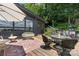 Relaxing backyard patio with comfortable seating and a grill, ideal for enjoying the outdoor space at 109 Joe Teague Rd, Hickory, NC 28601