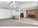 Finished basement featuring a cozy seating area and brick fireplace at 109 Joe Teague Rd, Hickory, NC 28601