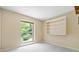 A minimalist bedroom with a large window and built-in shelving at 109 Joe Teague Rd, Hickory, NC 28601