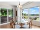 Dining area featuring a modern light fixture and scenic outdoor views from the large windows at 109 Joe Teague Rd, Hickory, NC 28601