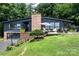 Beautiful one-story home with a brick chimney and a deck overlooking the lush greenery at 109 Joe Teague Rd, Hickory, NC 28601