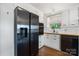 Bright kitchen featuring stainless steel appliances, white cabinetry and hardwood floors at 109 Joe Teague Rd, Hickory, NC 28601