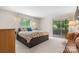 Bedroom featuring a large bed with storage and a sliding glass door with natural light at 109 Joe Teague Rd, Hickory, NC 28601
