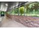 Enclosed patio with windows offering views of the landscaped backyard, accessible from the exterior at 109 Joe Teague Rd, Hickory, NC 28601