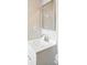 Updated bathroom featuring a white sink vanity, chrome faucet, and framed mirror at 116 Honeywood Ave, Charlotte, NC 28216