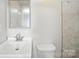 Clean bathroom featuring modern fixtures, a vanity with sink, and a tiled shower, showcasing a fresh and functional design at 116 Honeywood Ave, Charlotte, NC 28216