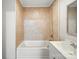 Standard bathroom featuring a tiled shower-tub combination and updated white vanity at 116 Honeywood Ave, Charlotte, NC 28216